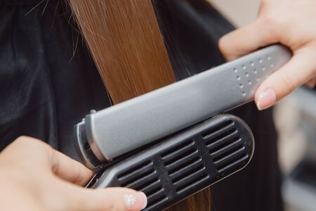 Keratin recovery hair and protein treatment pile with professional ultrasonic iron tool. Concept lamination, liftingの写真素材