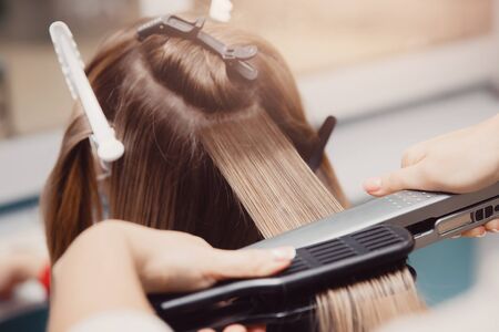 Keratin recovery hair and protein treatment pile with professional ultrasonic iron tool. Concept lamination, liftingの写真素材