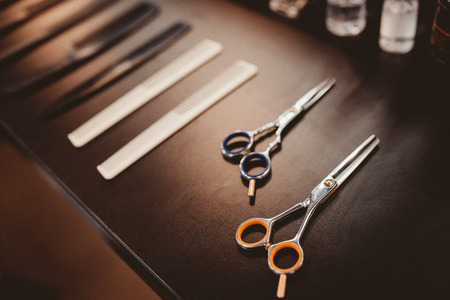 hairdresser's tools: combs, razors, scissors, clip-on hair clipperの写真素材