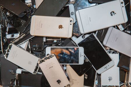 TOMSK, RUSSIA - November 29, 2017: broken panels and screens of iPhone phones lie in the service and are preparing for recycling and disposalのeditorial素材