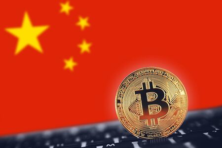 Bitcoin. Bitcoin on China red flag backgroundの写真素材