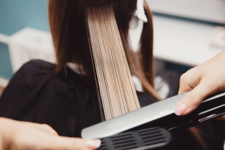 Keratin recovery hair and protein treatment pile with professional ultrasonic iron tool. Concept lamination, liftingの写真素材
