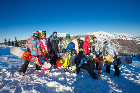 Sheregesh, Kemerovo region, Russia - January 4, 2018: Group of merry people with skis and snowboards playのeditorial素材