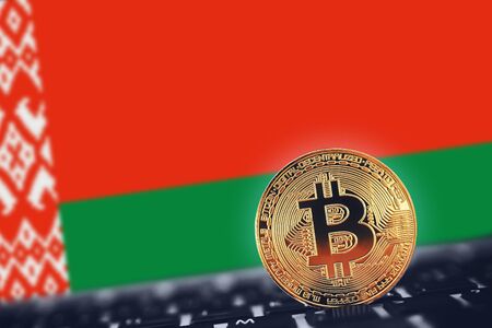 Gold Bitcoin on background of flag of Belarusの写真素材