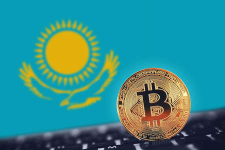 Gold Bitcoin on background of Flag of Kazakhstanの写真素材
