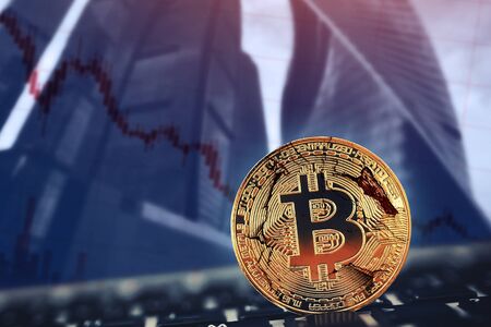Crash Bitcoin. Gold Bitcoin on background of dawn fall broken bubble chartの写真素材
