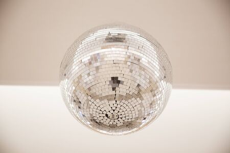 disco ball with reflective surface white backraundの写真素材