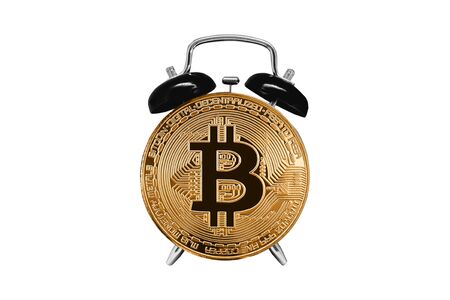 Bitcoin golden with clock and alarm clock on white isolated background. Concept time goes crypto currencyの写真素材
