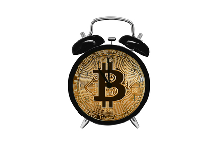 Bitcoin gold in a clock and alarm clock on a white isolated background. Concept time to sell, buy crypto-currencies for opening trades, exchange, marketの写真素材
