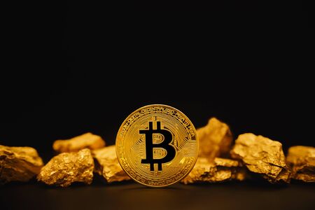 Bitcoin. Bitcoin on Golden nugget gold background. Finance conceptの写真素材