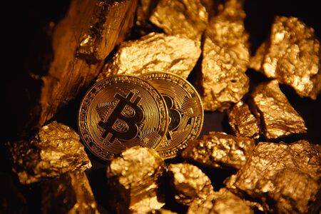 Bitcoin. Bitcoin on Golden nugget gold background. Finance conceptの写真素材