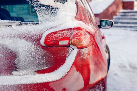 Winter car. Car in snow after storm and cyclone. Snow congestion. Concept cleaning machine in winter.の写真素材