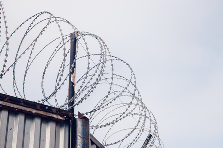 barbed wire. Wall border between the US and Mexicoの写真素材