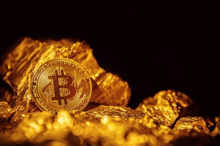 Bitcoin. Bitcoin on Golden nugget gold background. Finance conceptの写真素材