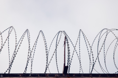 barbed wire. Wall border between the US and Mexicoの写真素材