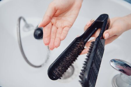 Tools hair cleaning from dust and dirt under running waterの写真素材