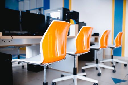 Workplace. Computer chairs, modern classroom, computers and studio equipmentの写真素材