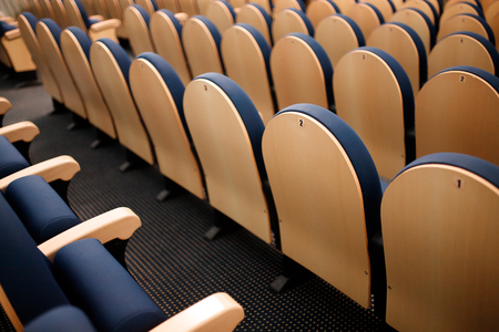 Seats are arranged in row in hall of opera, theater, cinema. Comfortable and soft chairs.の写真素材