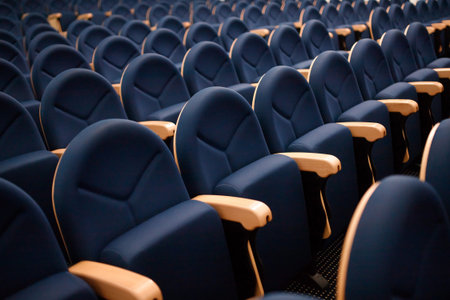 Seats are arranged in row in hall of opera, theater, cinema. Comfortable and soft chairs.