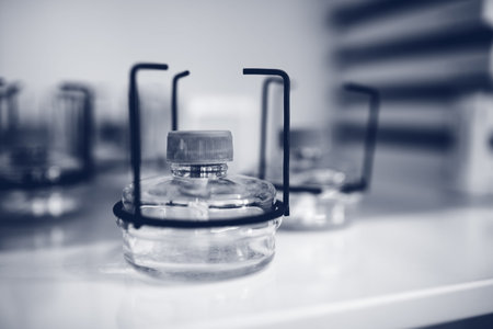 Bunsen flame and a glass stand. Spiritlamp blue backgroundの写真素材