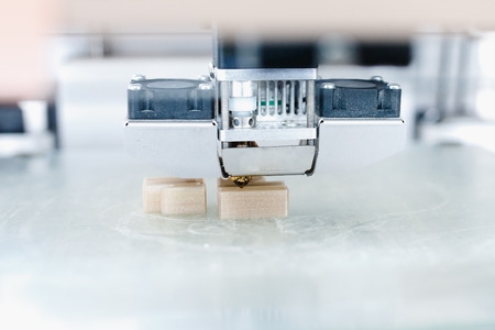 3D printer. Modern 3D printer printing figure home close-up macroの写真素材