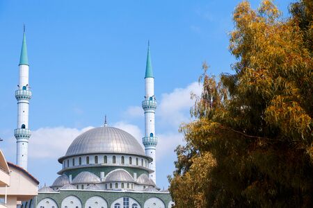 Beautiful white mosque in sunlight blue skyの写真素材