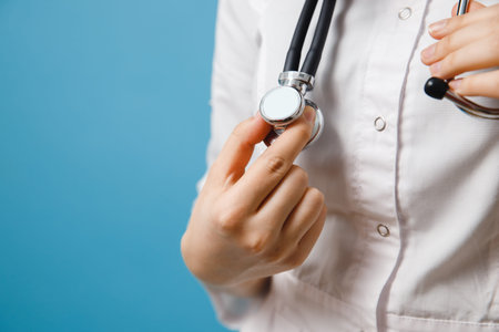 Stethoscope close-up. Doctor is holding medical tool while waiting for patient.の写真素材
