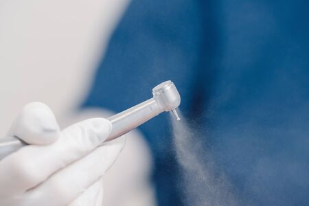 Stomatological instrument in dentists clinic. Doctor dentist takes dentistry instrumentの写真素材