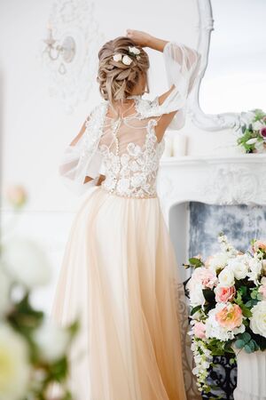 Hairstyle with fresh flowers. rear view close-up. Rustic styleの写真素材