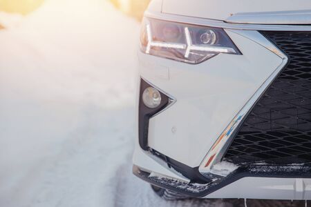Close-up of white car headlights, snow. Winterの写真素材