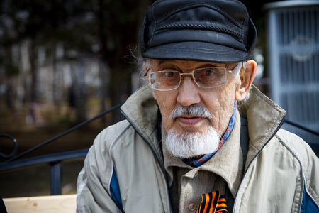 Tomsk, RUSSIA - MAY 9, 2017: Immortal regiment procession in Victory Day. Elderly man Veteranのeditorial素材
