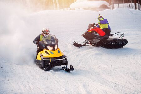 Snowmobile. Snowmobile races in the snow. Concept winter sports, racers.の写真素材