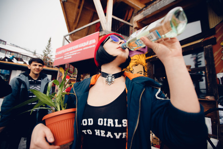 Sheregesh, Kemerovo, Russia - April 7, 2018: Grelka Fest: Group of people ski and snowboard riders in carnival costumes.のeditorial素材
