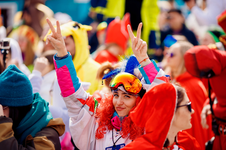 Sheregesh, Kemerovo, Russia - April 7, 2018: Grelka Fest: Group of people ski and snowboard riders in carnival costumes.のeditorial素材