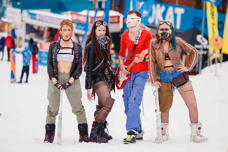 Sheregesh, Kemerovo, Russia - April 7, 2018: Grelka Fest: Group of people ski and snowboard riders in carnival costumes.のeditorial素材