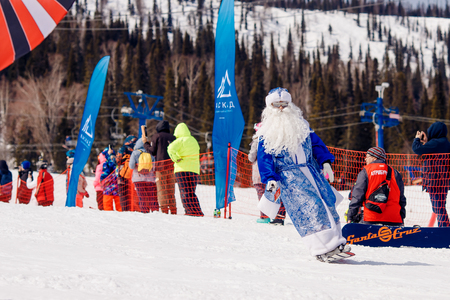 Sheregesh, Kemerovo, Russia - April 7, 2018: Grelka Fest: Group of people ski and snowboard riders in carnival costumes.のeditorial素材