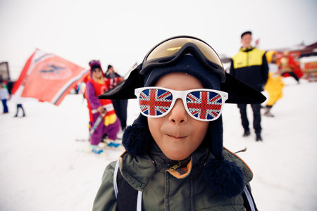 Sheregesh, Kemerovo, Russia - April 7, 2018: Grelka Fest: Group of people ski and snowboard riders in carnival costumes.のeditorial素材