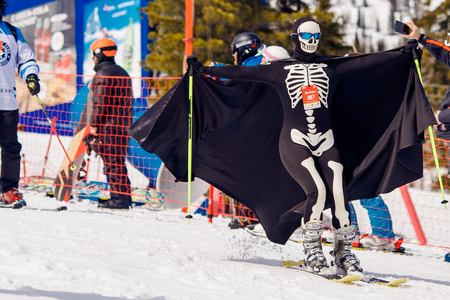 Sheregesh, Kemerovo, Russia - April 7, 2018: Grelka Fest: Group of people ski and snowboard riders in carnival costumes.のeditorial素材