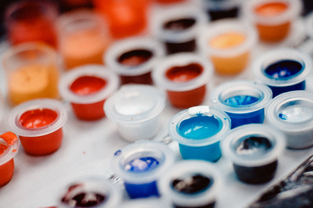 Close-up tattoo of paint pigment of different colors in boxes.の写真素材