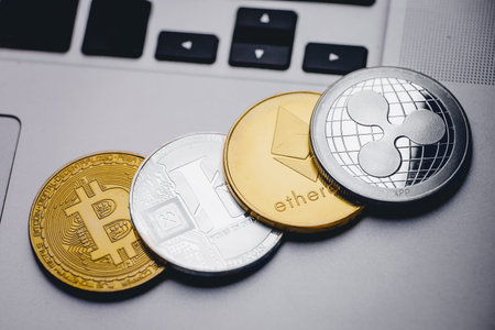 Bitcoin, litecoin, ripple, ethereum On background of computer keyboard, concept of crypto currency.の写真素材