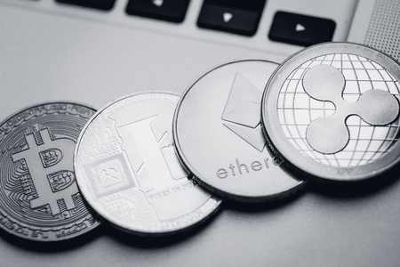 Bitcoin, litecoin, ripple, ethereum On background of computer keyboard, concept of crypto currency.の写真素材