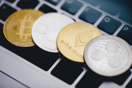 Bitcoin, litecoin, ripple, ethereum On background of computer keyboard, concept of crypto currency.の写真素材