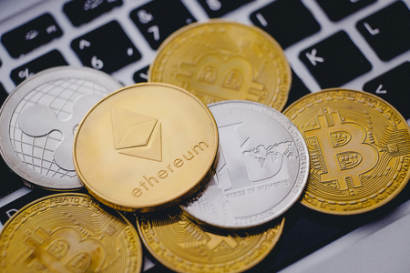 Bitcoin, litecoin, ripple, ethereum On background of computer keyboard, concept of crypto currency.の写真素材