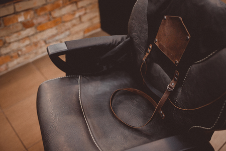 Barbershop apron armchair modern hairdresser, barber shop for men.の写真素材