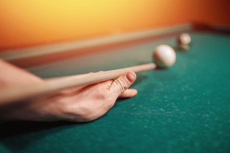 Balls for billiards snooker are triangle, man smashes cue