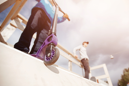 Close-up wheel from scooter for an extreme ride on ramp and springboards. Concept teenagers sport, bullies.の写真素材