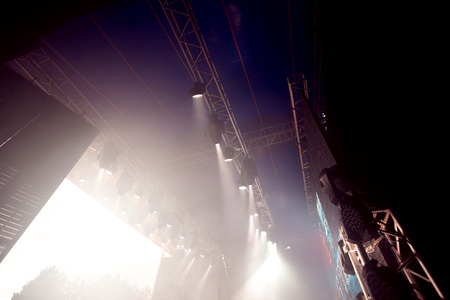 Concert show background crowd of people, stage and lighting equipment.の写真素材