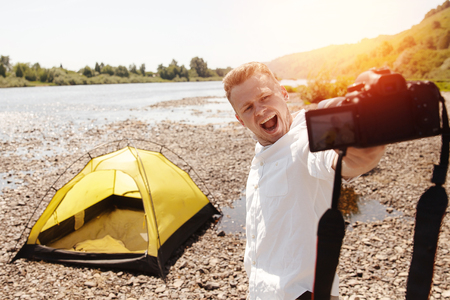 Blogger photographer recorder Selfie video travel about travel, freedom. Concept lifestyle tripの写真素材