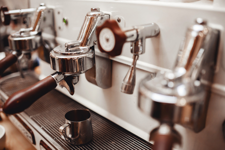 Professional coffee machine for fresh beverage preparation from ground beansの写真素材