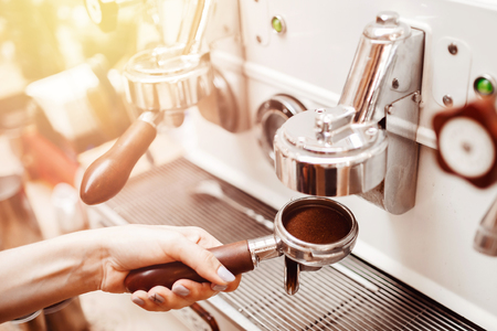 Close-up prepares espresso in coffee shop baristaの写真素材